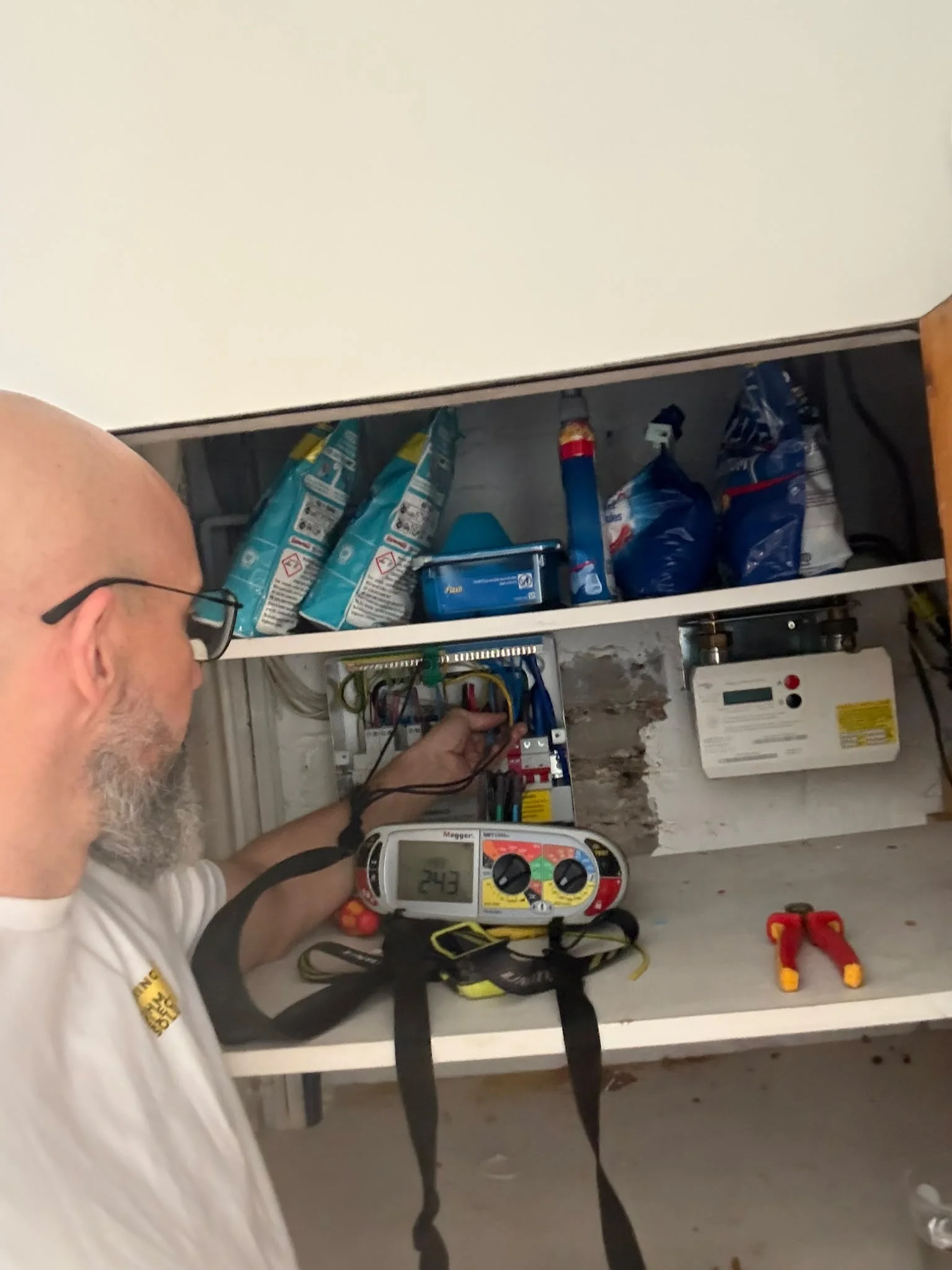 Electrician testing the RCBOs during a fuse board change in Hampton by Bring it Ohm Electrical Solutions